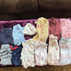 Lot of newborn long sleeve footie pajamas, pants, shorts